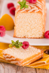 Lemon sponge cake with pomegranate.	
