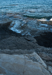 Sea waves on the stones of the sea