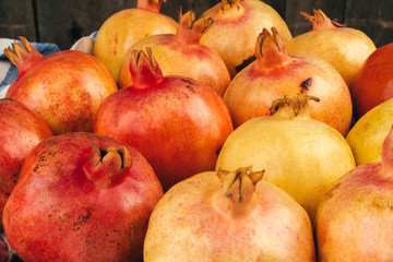 Fototapeta na wymiar Group of pomegranate fruits close up background