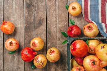 Pile of ripe  pomegranate on wooden backgfround