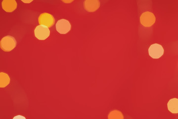 Yellow glitter boke background texture on red