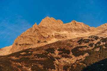 Beautiful alpine mountain landscape of Totes Gebirge, Austria. High rocky walls and alpine summits. Limestone mountains, green meadows.