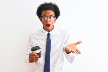 Young african american businessman drinking cup of coffee over isolated white background very happy and excited, winner expression celebrating victory screaming with big smile and raised hands