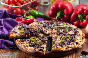 Spicy pizza with minced meat and jalopeno