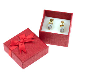 Earrings in gift boxes Isolated on the white background.
