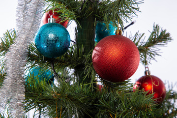 Christmas toys on fir branches