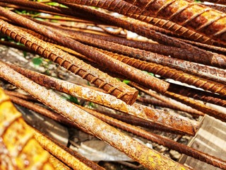 Scrapheap of left rusty metal in garbage dump