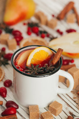Christmas hot mulled wine in rustic cup close up