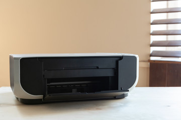 Fototapeta premium Close up of an office table with printer on it