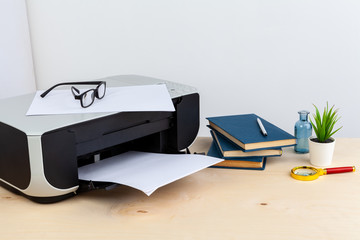 Office printer close up on a wooden table
