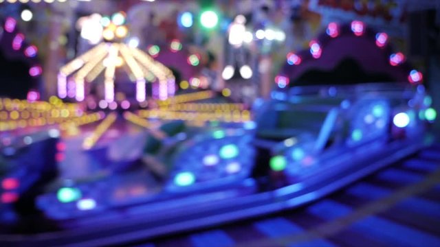Blurred footage of riding carousel backwards with high speed,real time shot