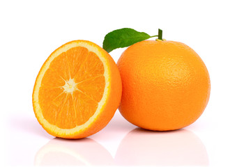 Closeup whole and half ripe fresh mandarin or tangerine orange fruit with green leaf isolated on white background with clipping path.