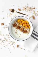 Fototapeta na wymiar Bowl of homemade granola with yogurt and cereals