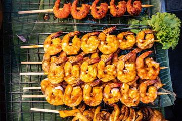 Street food in Bangkok, Thailand : Grilled prawns at night market for