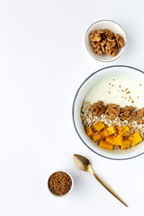 Bowl of homemade granola with yogurt and cereals