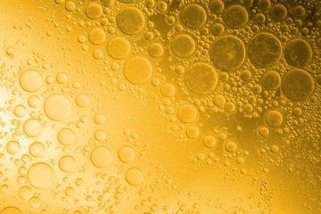 Biodiesel, bubbles biofuel, vegetable oil, yellow and orange emulsion bubbles background