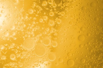 Biodiesel, bubbles biofuel, vegetable oil, yellow and orange emulsion bubbles background