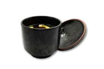 Miso soup in ceramic soup bowl on isolated white background 
