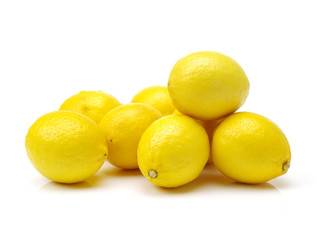Ripe lemons on white background