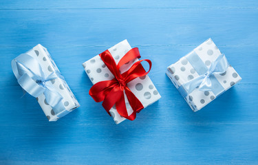 on a blue table is a box in a gift box, gift, surprise, New Year’s present,