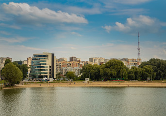 small Eastern European city waterfront district urban view with buildings and TV tower in clear day weather time 