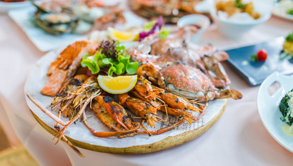 Delicious seafood of fresh seafood with shrimps, prawns, crabs, salmon, squid and mussels at luxury restaurant