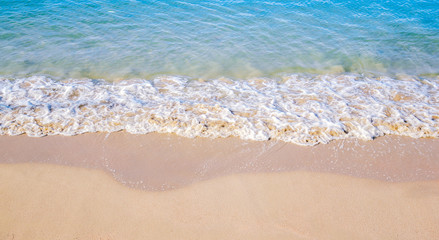 Fototapeta na wymiar Blue sea wave on the beach summer background
