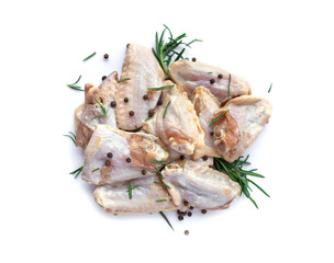 Raw chicken wings with garlic, pepperand rosemary isolated