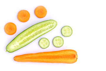 Fresh cucumber and carrot cut sliced isolated on white background. Beauty and spa products concept. Top view. Flat lay.