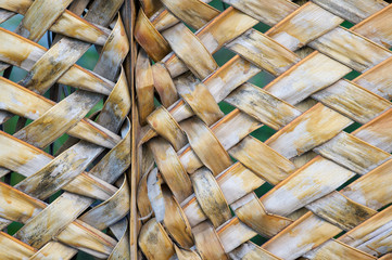 Abstract close-up view of wall of woven palm frond dividing of a traditional tropical village hut in Bahia, Brazil