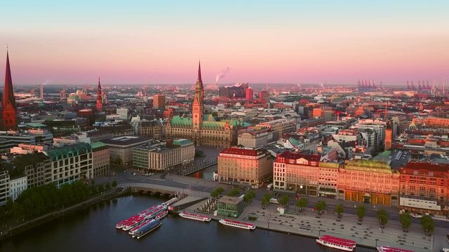 drone aerial shot of hamburg old town at sunrise flying orbit over waterfront
