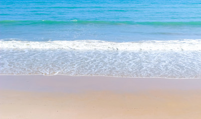 Fototapeta na wymiar tropical beach clear water sea wave and white sand background