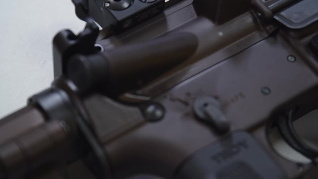 assault rifle on a white table, in a shooting range