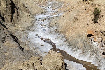 hypersaline river with salt that looks like snow