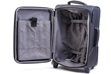 Opened big black suitcase isolated on white background