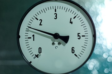 Obraz na płótnie Canvas Gas pressure gauge on technical and machine background.