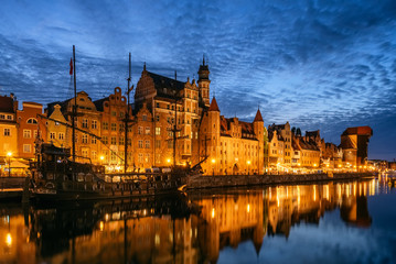 Panorama of the Gdansk old town and famous crane at night Gdansk