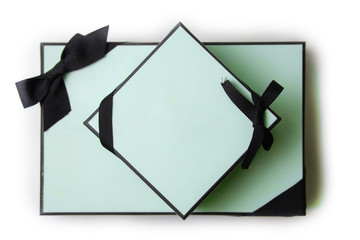 gift boxes with black bow and ribbon on white background