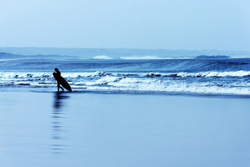 A surfer at the beach of Essaouira.