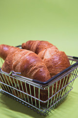 Macro shoot of croissants in shopping basket
