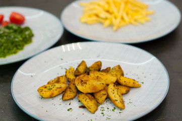 Fried potatoes with spices. Vegetarian food side dish or appetizer.