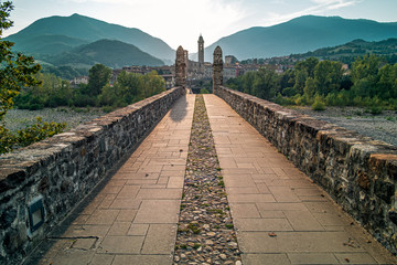 The old medieval bridge of the famous italian borough of Bobbio, Piacenza province, Emilia Romagna, Italy. - obrazy, fototapety, plakaty