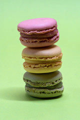 Macro shot of stack of macarons over green mint background