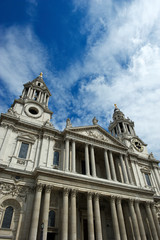 Fototapeta na wymiar Scenic sunny view of the West Front facade of St Paul's Cathedral in London, UK under blue sky