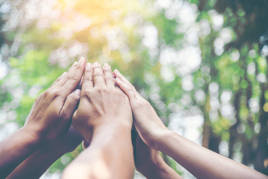 People Hands Assemble As A Connection Meeting Teamwork Concept. Group Of People Assembly Hands As Business Or Work Achievement. Man And Women Touch Each Other Hands Outdoor. Teamwork Conceptual.