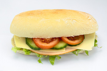 chicken and raw vegetable sandwich on a white background