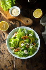 Homemade Caesar salad with chicken and avocado