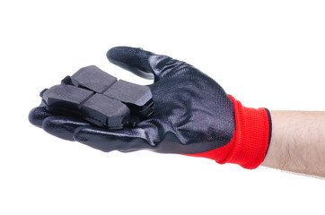 New brake pads for cars in hand on white background isolation