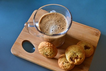 cup of coffee and cookies on wooden table