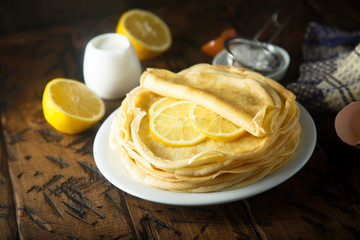 Homemade crepes with lemon and sugar